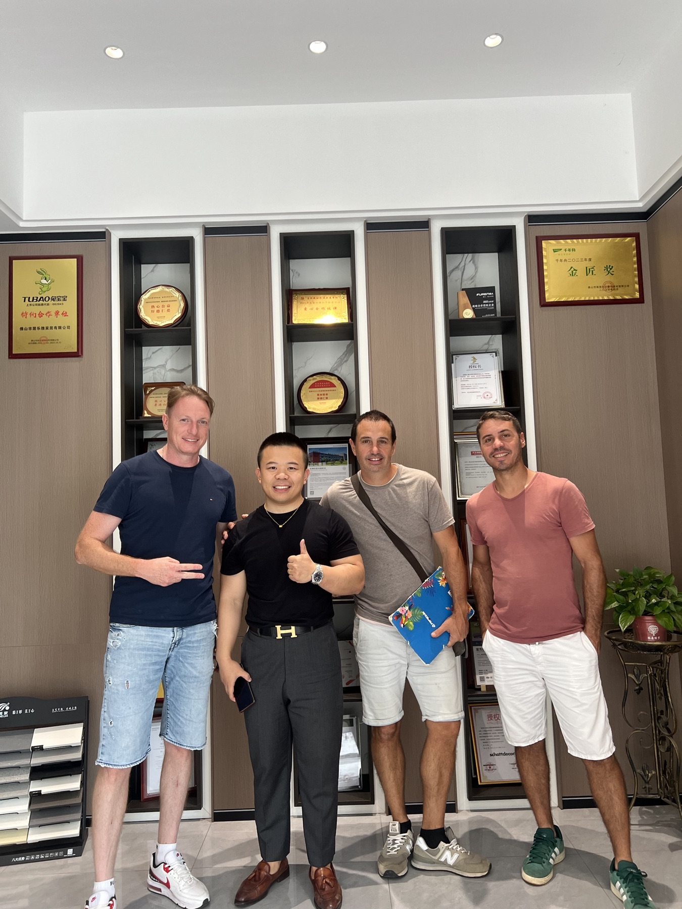 Four people photographed together during a visit to the Jerome showroom